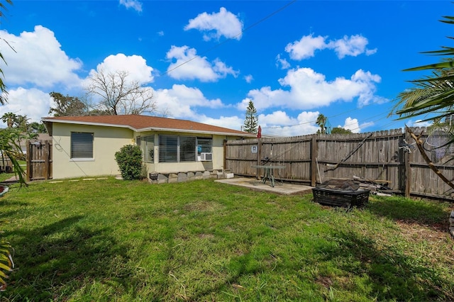 back of house with cooling unit, a patio area, and a lawn