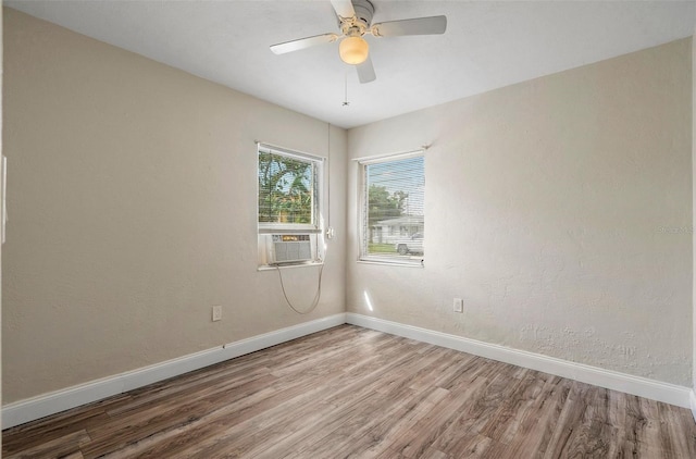 spare room with ceiling fan and hardwood / wood-style floors