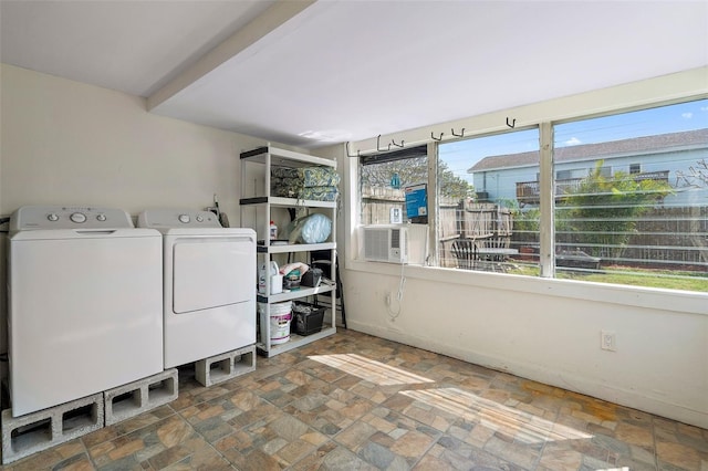 clothes washing area featuring cooling unit and washing machine and clothes dryer