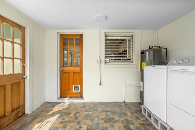 entrance to property featuring washer and dryer and water heater