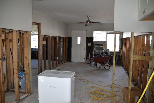 entrance foyer featuring ceiling fan and cooling unit