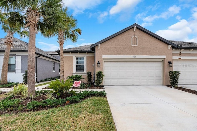 single story home featuring a garage