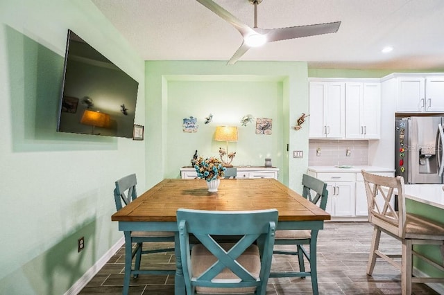 dining room featuring ceiling fan