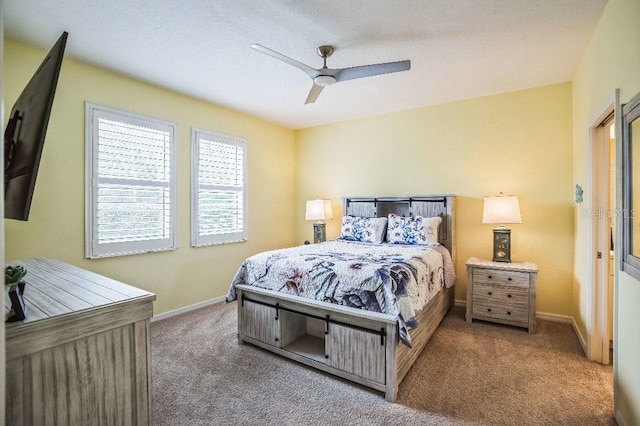 bedroom featuring ceiling fan and carpet floors