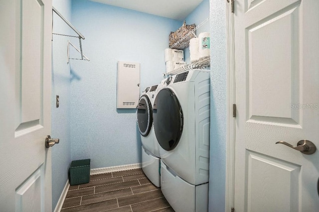 clothes washing area with washing machine and clothes dryer