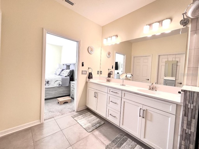 bathroom with vanity and tile patterned flooring