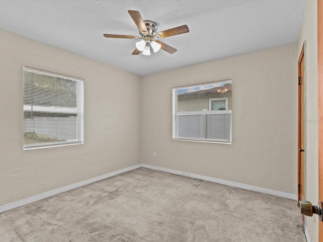 empty room with light carpet and ceiling fan