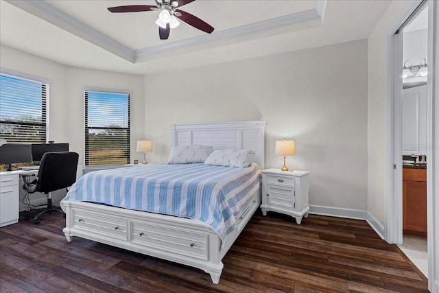 bedroom featuring ceiling fan, dark hardwood / wood-style flooring, and a raised ceiling