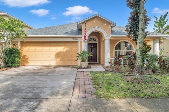 single story home with a garage