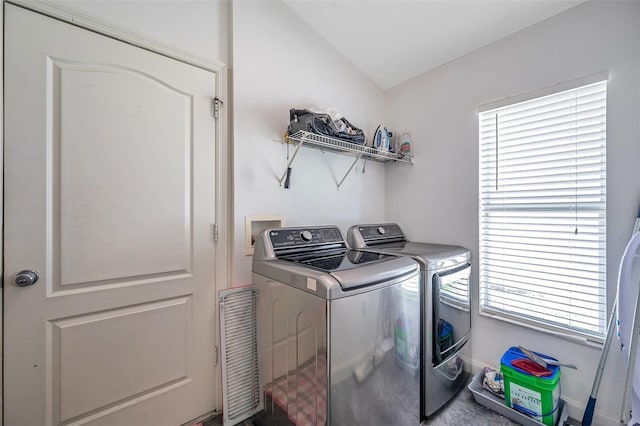 laundry room featuring washing machine and dryer