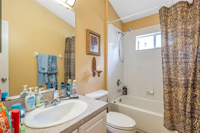 full bathroom with toilet, vanity, and shower / bath combination with curtain