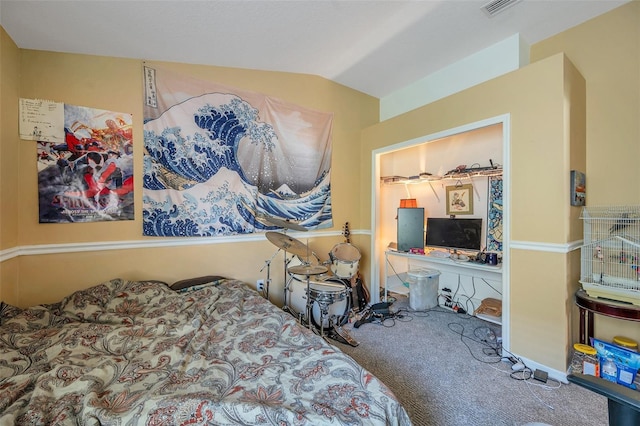 bedroom with vaulted ceiling and carpet flooring