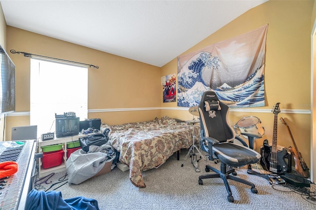 bedroom with lofted ceiling and carpet floors