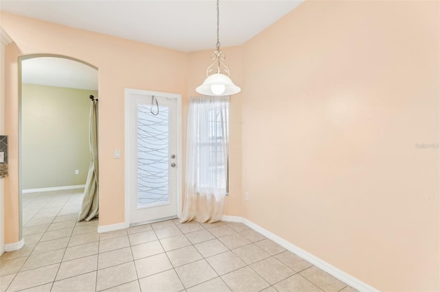 unfurnished dining area with light tile patterned floors