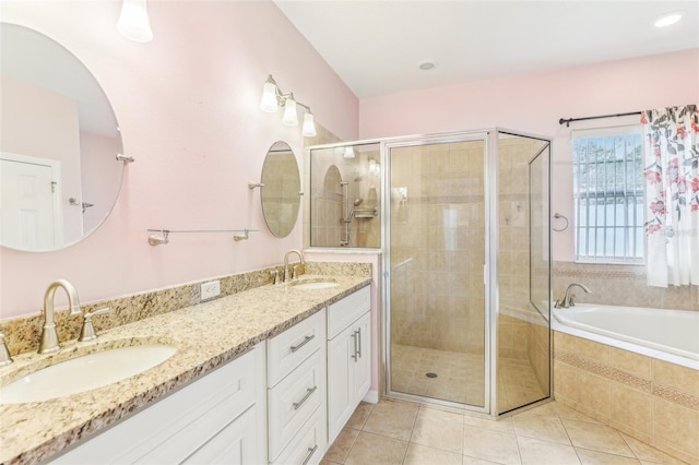 bathroom featuring vanity, separate shower and tub, and tile patterned floors