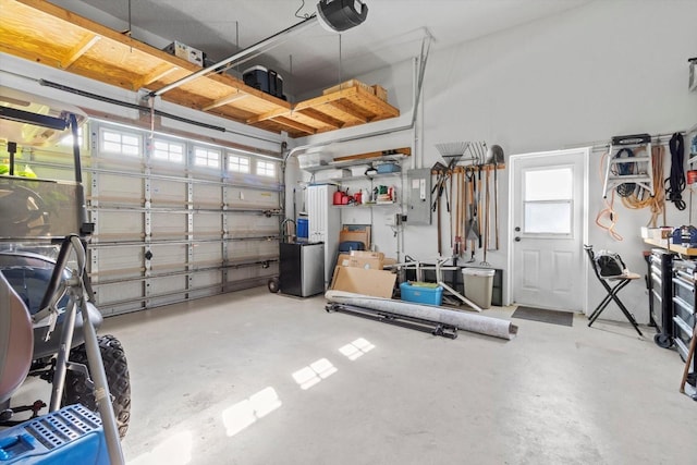 garage featuring electric panel and a garage door opener