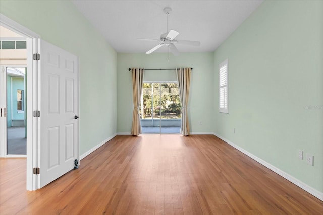 spare room featuring ceiling fan and light hardwood / wood-style floors