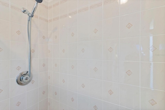 bathroom with tiled shower