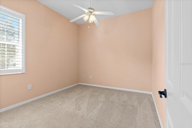 carpeted empty room with ceiling fan