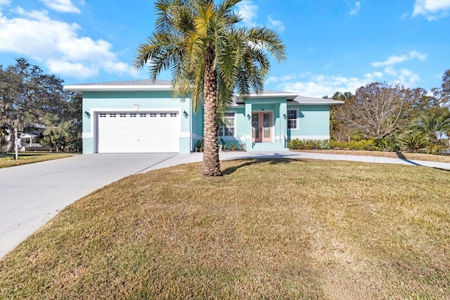 view of front of home featuring a front yard and a garage