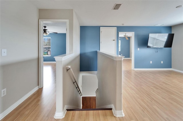 stairs featuring wood-type flooring