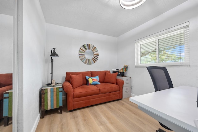 office space with light hardwood / wood-style flooring