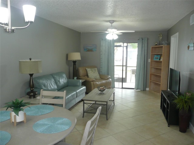 tiled living room featuring ceiling fan and a textured ceiling