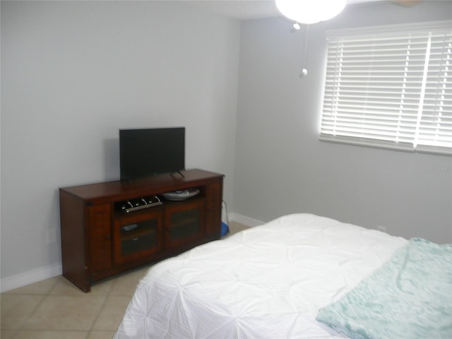 bedroom with light tile patterned floors