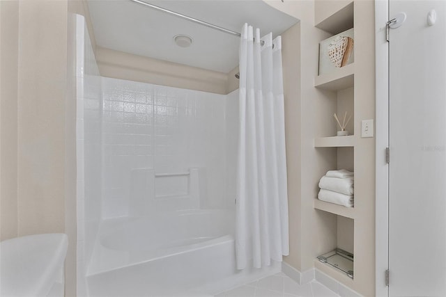 bathroom with tile patterned flooring, built in shelves, and shower / bath combination with curtain