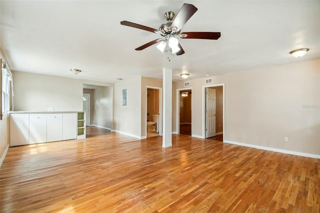 empty room featuring light hardwood / wood-style floors and ceiling fan