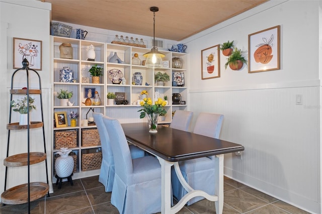 tiled dining space with wooden ceiling