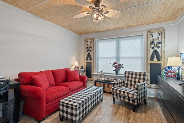 living room featuring hardwood / wood-style flooring, wooden ceiling, and ceiling fan