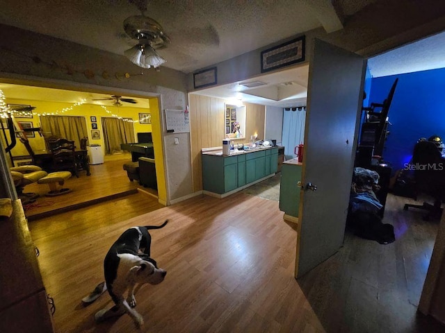 interior space with wood-type flooring and a textured ceiling