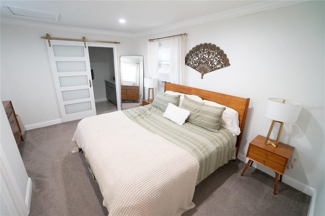 carpeted bedroom with crown molding, connected bathroom, and a barn door