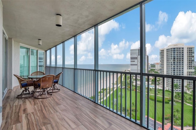 sunroom / solarium with a water view