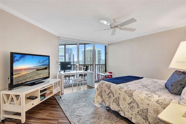 bedroom with ceiling fan, a wall of windows, ornamental molding, and hardwood / wood-style flooring