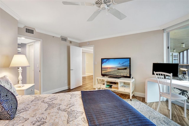 bedroom with ornamental molding, light wood-type flooring, and ceiling fan