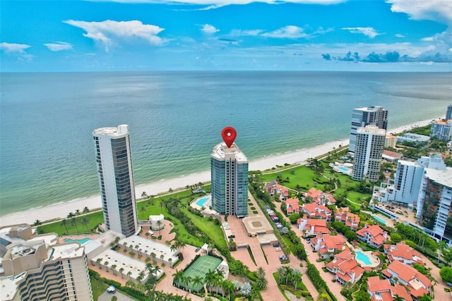 birds eye view of property with a view of the beach and a water view