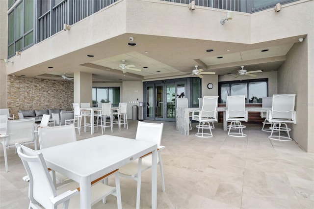 view of patio / terrace featuring ceiling fan