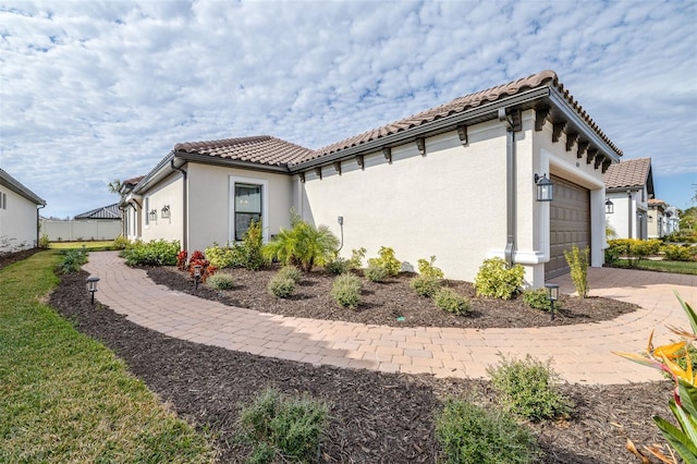 view of property exterior with a garage