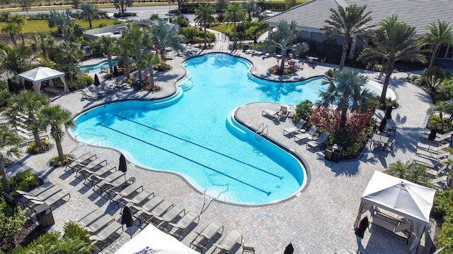 view of swimming pool featuring a patio and a gazebo