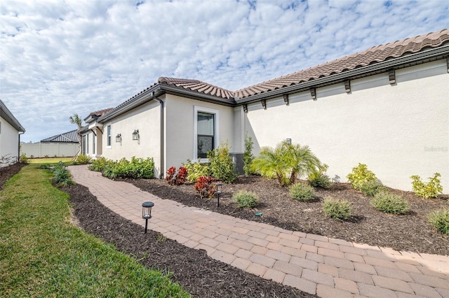 view of home's exterior featuring a yard