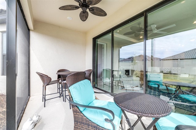 balcony featuring ceiling fan