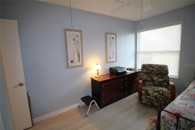 bedroom with ceiling fan and light hardwood / wood-style floors