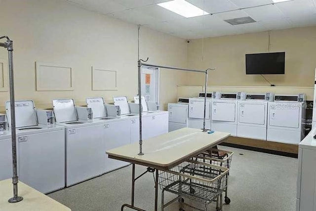 clothes washing area featuring independent washer and dryer