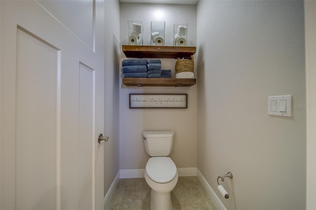 bathroom with tile patterned floors and toilet