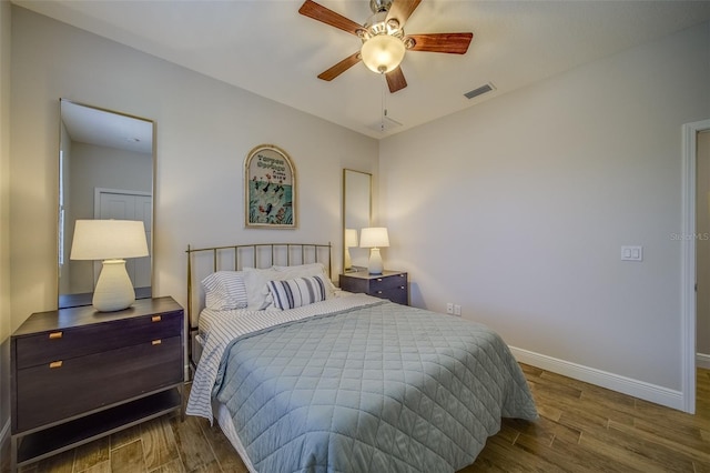 bedroom with ceiling fan and hardwood / wood-style flooring