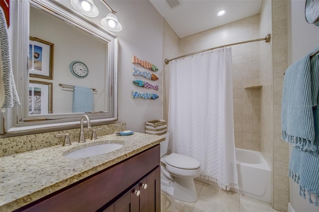 full bathroom with vanity, shower / bath combo with shower curtain, tile patterned floors, and toilet