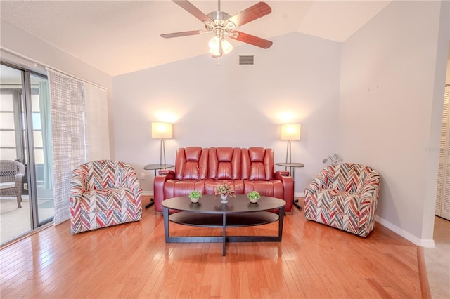 living room featuring ceiling fan, vaulted ceiling, and hardwood / wood-style floors