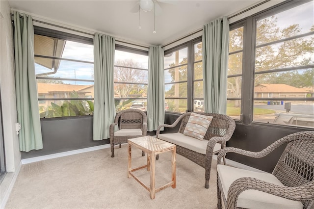 sunroom / solarium with plenty of natural light and ceiling fan